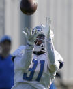 Detroit Lions safety Dean Marlowe catches during a drill at the Lions NFL football camp practice, Wednesday, Aug. 4, 2021, in Allen Park, Mich. (AP Photo/Carlos Osorio)