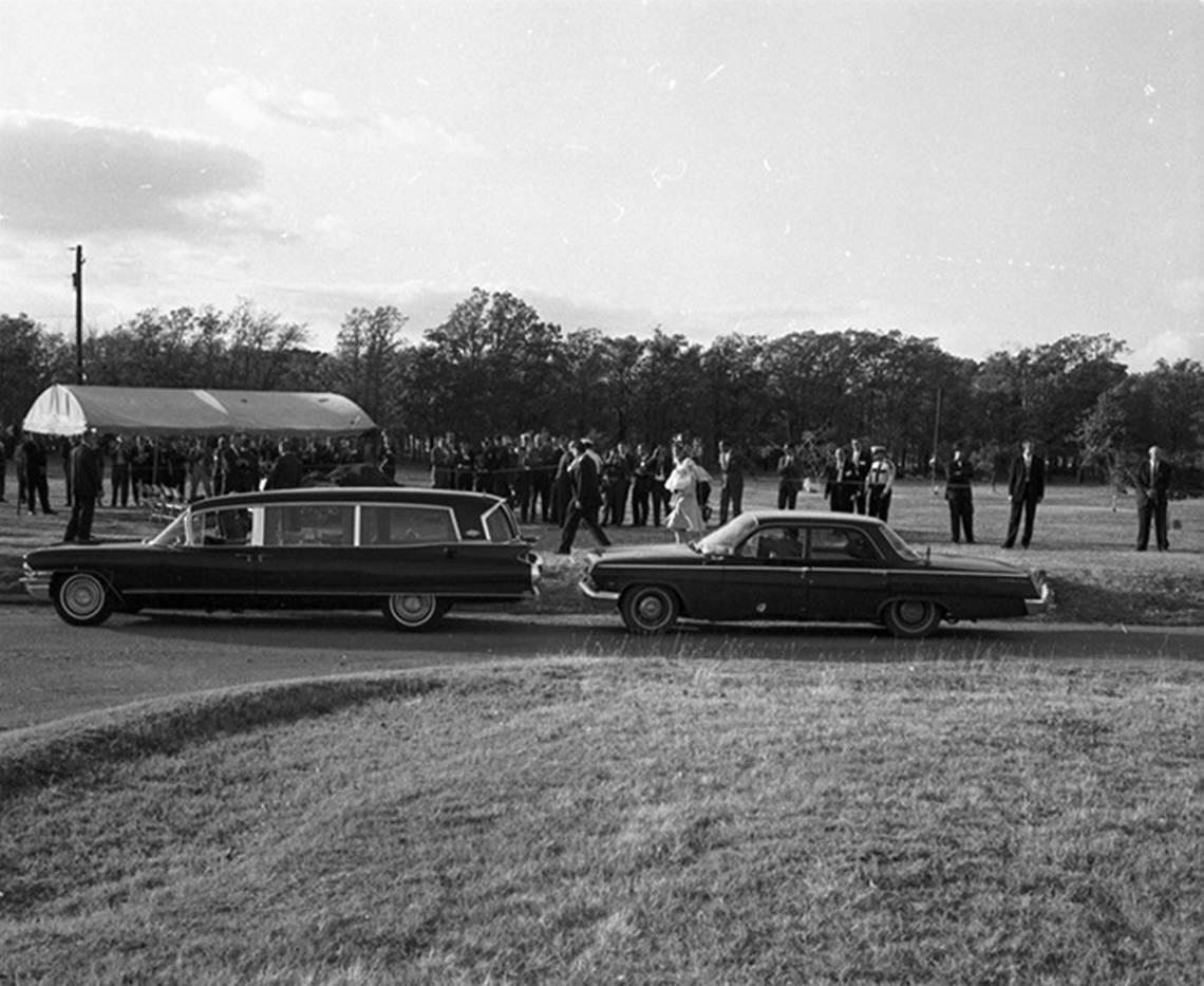 Nov. 25, 1963: Lee Harvey Oswald funeral, Fort Worth’s Rose Hill Cemetery; Marina Oswald, carrying child, walks toward gravesite.