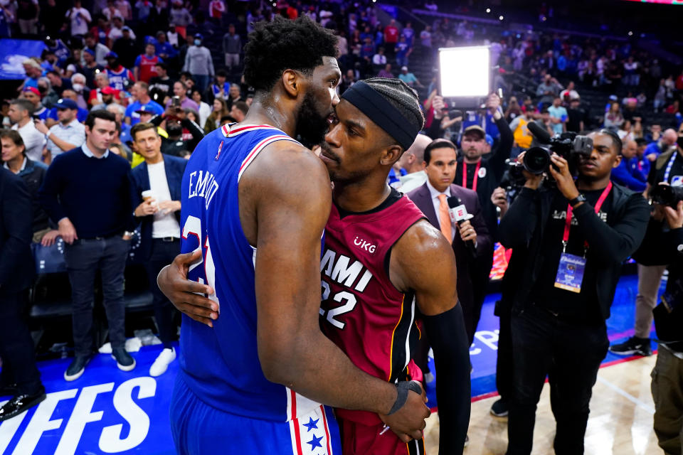 Miami Heat's Jimmy Butler, right, and Philadelphia 76ers' Joel Embiid embrace after Game 6 of an NBA basketball second-round playoff series, Thursday, May 12, 2022, in Philadelphia. (AP Photo/Matt Slocum)