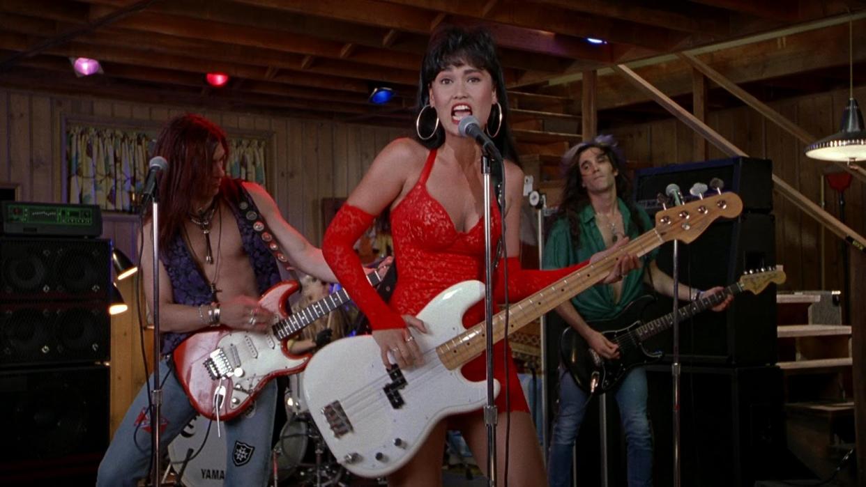 Here’s how to copy Tia Carerre’s outfits in “Wayne’s World,” even though we’re NOT WORTHY