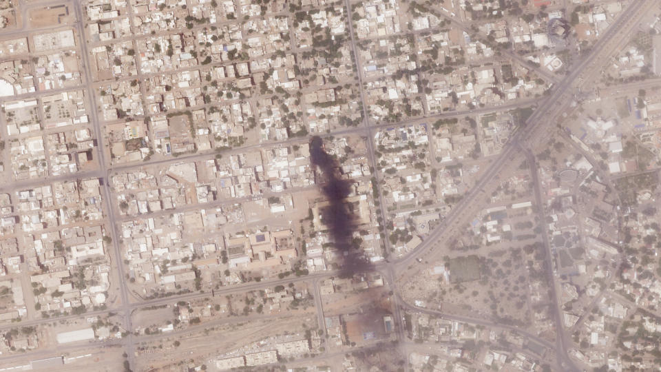 This satellite photo from Planet Labs PBC shows a fire near several hospitals in Khartoum, Sudan, Tuesday, April 18, 2023. Fighting between forces loyal to dueling generals raged in Sudan for a fifth day Wednesday, April 19, hours after an internationally brokered truce was supposed to have come into effect. (Planet Labs PBC via AP)