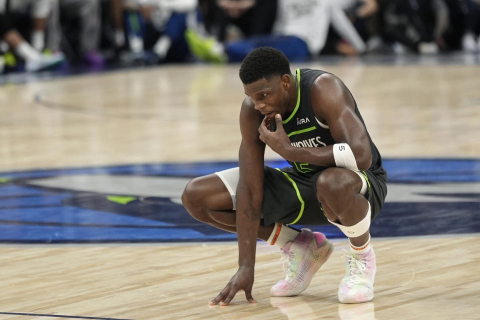 Minnesota Timberwolves guard Anthony Edwards pauses on the court in the closing moments of a loss against the Dallas Mavericks during the second half of Game 5 of the Western Conference finals in the NBA basketball playoffs, Thursday, May 30, 2024, in Minneapolis. (AP Photo/Abbie Parr)