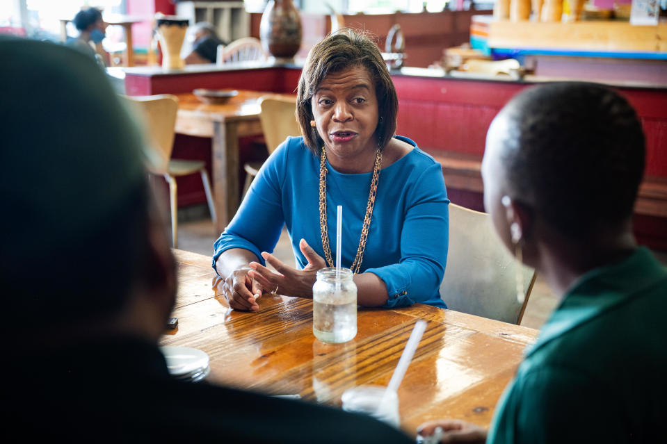 FILE: Cheri Beasley, a Democratic U.S. Senate candidate, speaks with Leonardo and Zweli Williams, co-owners of Zwelis, a Zimbabwean restaurant, in Durham, North Carolina on July 7, 2021. / Credit: Allison Lee Isley/The Washington Post via Getty