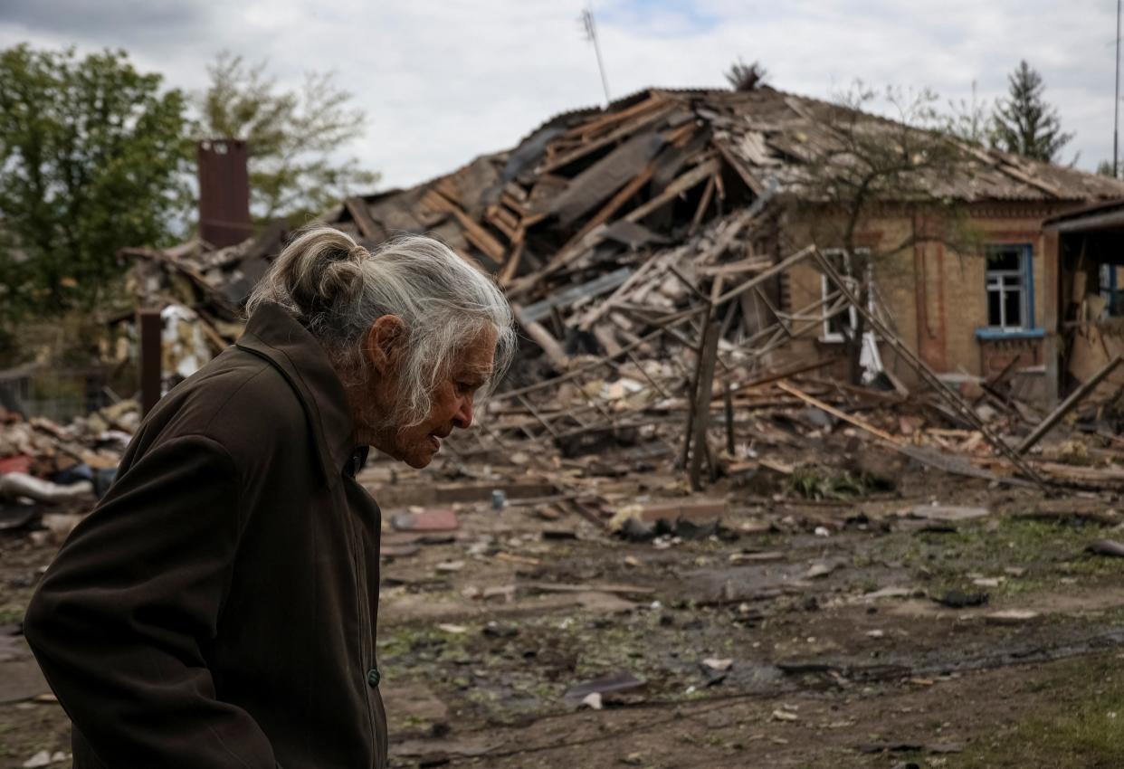 A local resident passes by a house hit by a Russian military strike, amid Russia's attack on Ukraine, in the town of Sloviansk (REUTERS)