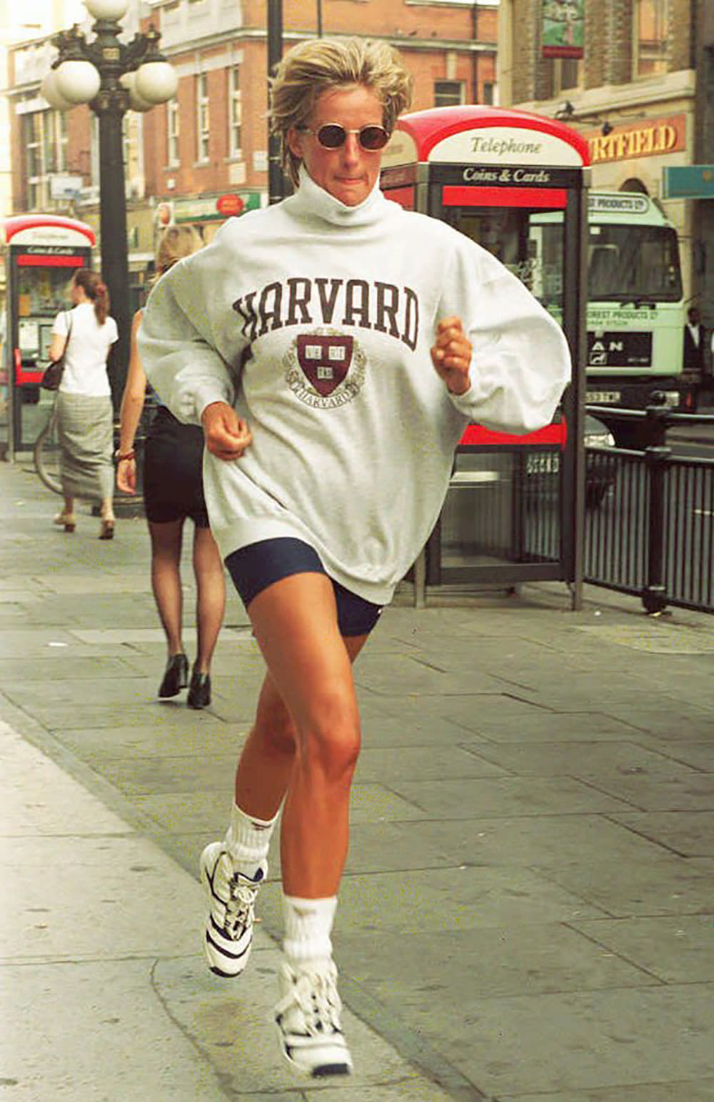 PRINCESS OF WALES BRITISH ROYALTY, SPRINTING, RUNNING, SHORTS, SWEAT SHIRT, SUNGLASSES, FULL LENGTH