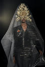 A model wears a design from the Philip Treacy Spring/Summer 2013 collection during London Fashion Week, Sunday, Sept. 16, 2012. (AP Photo/Jonathan Short)