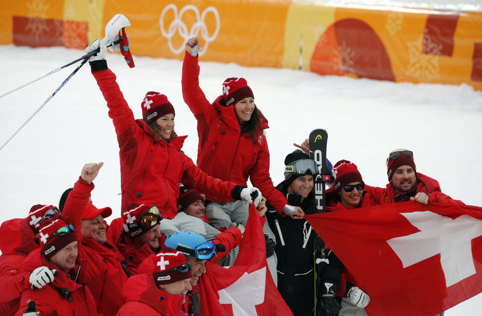 <p>Switzerland’s gold and silver medalists Michelle Gisin and Wendy Holdener are hoisted aloft by team members after the Women’s Combined Slalom at the PyeongChang 2018 Winter Olympics on Feb. 22, 2018.<br> (AP Photo/Christophe Ena) </p>