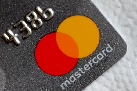 A Mastercard logo is seen on a credit card in this picture illustration