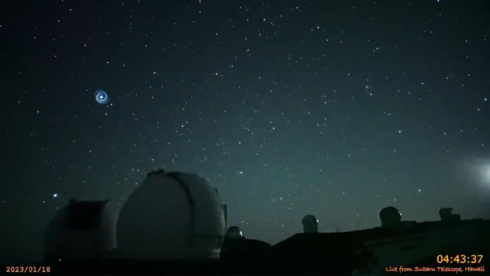 A shot of the spiral-shaped light in the sky above Hawaii captured Jan. 18 by the Subaru-Asahi Star Camera on Mauna Kea.