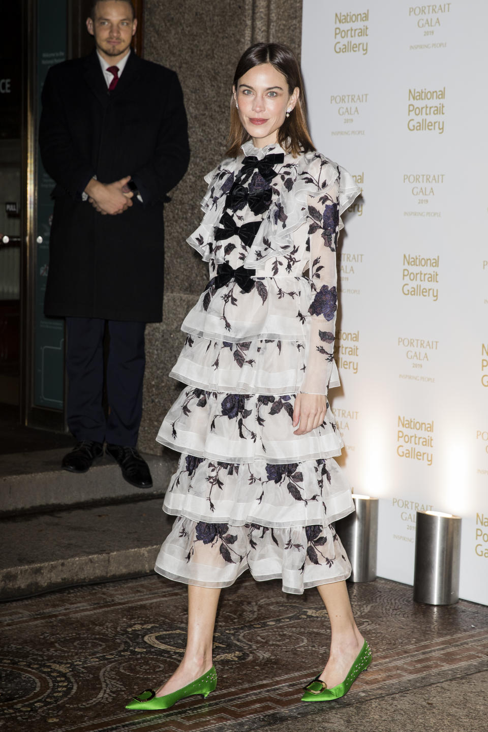 <p>The British model and fashion designer looked as on point as ever in a tiered monochrome gown by Erdem, paired with metallic green pumps. <em>[Photo: Getty]</em> </p>