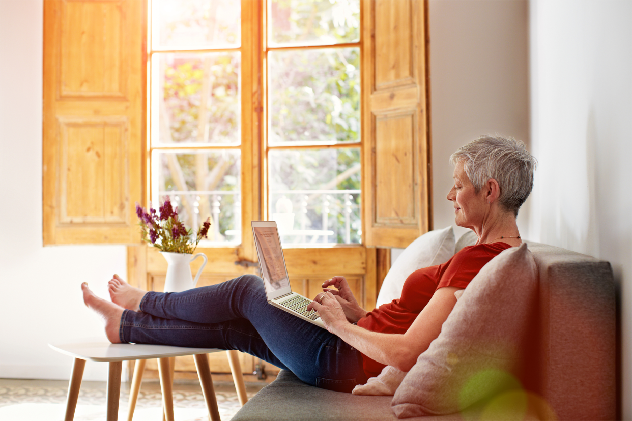 older woman working on couch