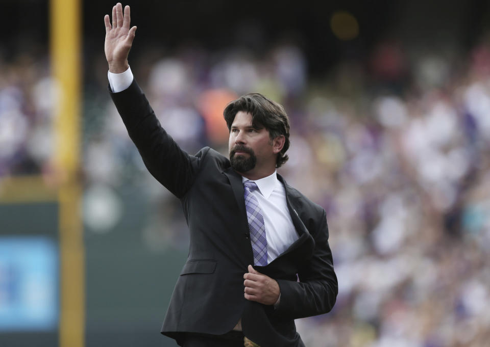 FILE - Retired Colorado Rockies first baseman Todd Helton waves at the crowd after his number was retired during a ceremony before the Rockies host the Cincinnati Reds in the first inning of a baseball game in Denver on Sunday, Aug. 17, 2014. Adrián Beltré, Joe Mauer, Todd Helton and Billy Wagner could be elected to the Hall of Fame on Tuesday, Jan. 23, 2024, which could mark the fourth time in a decade that the Baseball Writers' Association of America elected four members. (AP Photo/David Zalubowski, File)