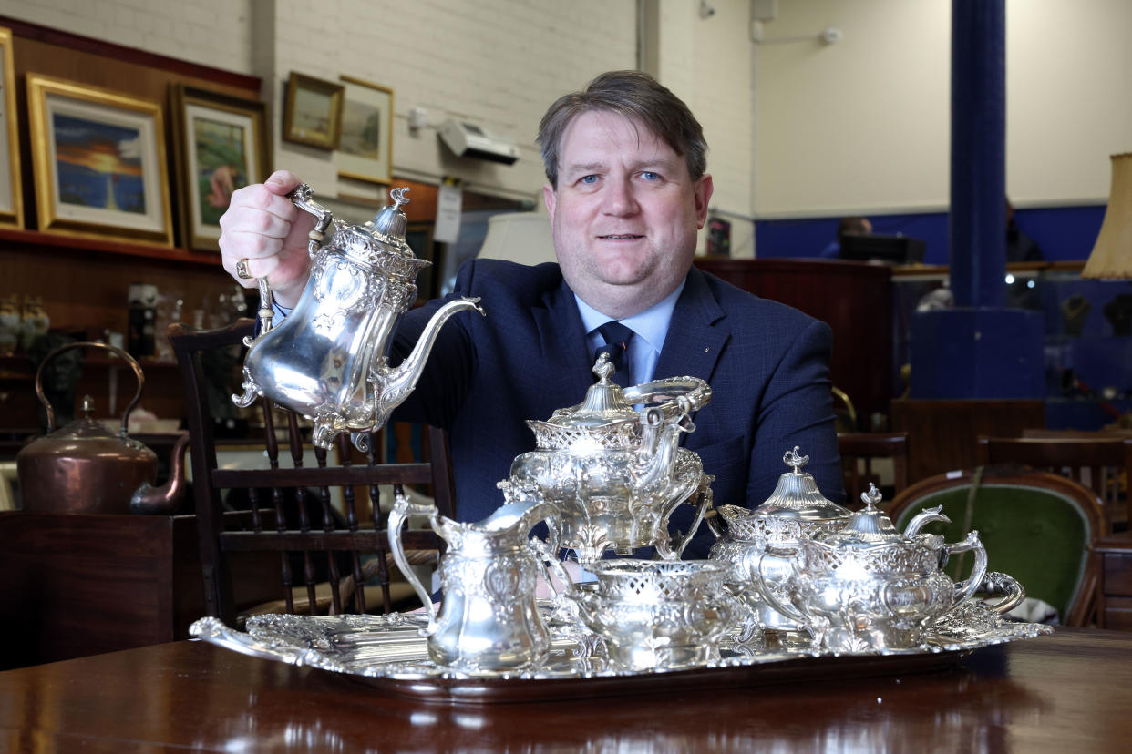 Karl Bennett with a seven piece silver tea service used to entertain the Duke of Edinburgh (Press Eye/PA)