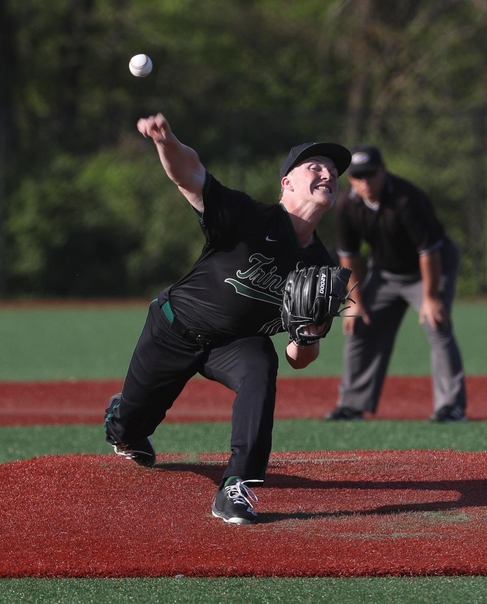 Trinity's Paul Osting (11) delivered a pitch against  St. X at the St. X High School in Louisville, Ky. on April 27, 2022.  St. X won 8-2.