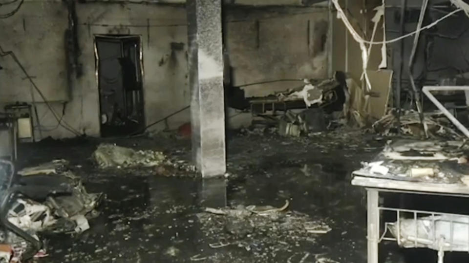 This photo shows inside the Welfare Hospital after a deadly fire in Bharuch, western India, Saturday, May 1, 2021. The fire in a COVID-19 ward of the hospital killed multiple patients early Saturday, as the country grappling with the worst outbreak yet steps up a vaccination drive for all its adults even though some states say don't have enough jabs. (KK PRODUCTIONS via AP)