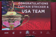 Team USA poses with the trophy at the closing ceremony after the Ryder Cup matches at the Whistling Straits Golf Course Sunday, Sept. 26, 2021, in Sheboygan, Wis. (AP Photo/Jeff Roberson)