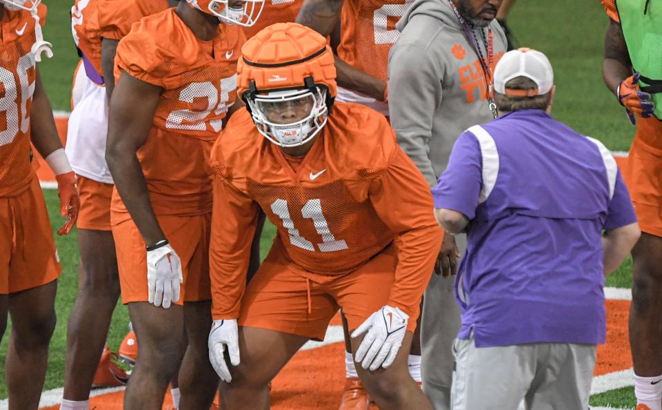 Clemson defensive lineman Peter Woods (11) with Clemson defensive coordinator Wes Goodwin during the first practice at Clemson, S.C. Friday, August 4, 2023.
