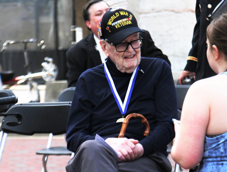 World War II Veteran James Thompson, 96, speaks with a reporter after the Military Officers Association of Mid-Missouri's Memorial Day Wreath-Laying Ceremony on May 29, 2023, in Columbia, Mo. Thompson was one of the ceremony's special guests.