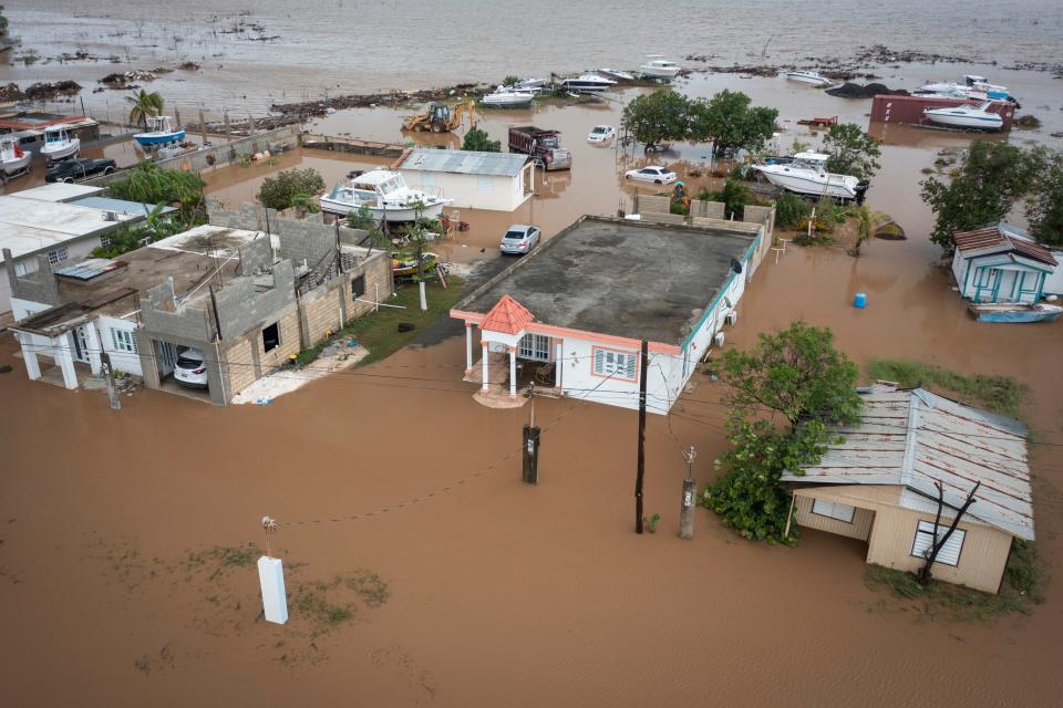 Homes are flooded on Salinas Beach after the passing of Hurricane Fiona in Salinas, Puerto Rico, Monday, Sept. 19, 2022. (AP Photo/Alejandro Granadillo) ORG XMIT: XRE118