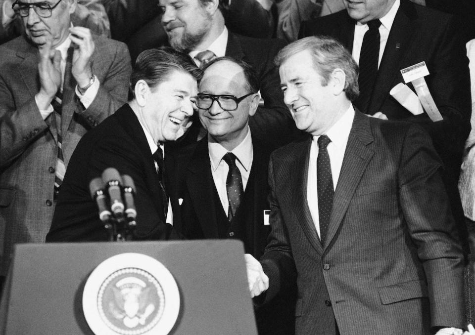 President Ronald Reagan, left, shakes hands with Moral Majority leader Jerry Falwell at a convention of national religious broadcasters on Jan. 30, 1984, in Washington, D.C. <a href="https://newsroom.ap.org/detail/ReaganReligiousRight/040027e6b6c442e18101e4ddb20fb780/photo?Query=Moral%20Majority&mediaType=photo&sortBy=arrivaldatetime:asc&dateRange=Anytime&totalCount=35&currentItemNo=16" rel="nofollow noopener" target="_blank" data-ylk="slk:AP Photo/Ira Schwarz;elm:context_link;itc:0;sec:content-canvas" class="link ">AP Photo/Ira Schwarz</a>