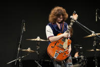 Japanese musician TAKESHI holds his guitar which was found out as a stolen Gretsch guitar of Canadian rock legend Randy Bachman before returning it to Bachman during the Lost and Found Guitar Exchange Ceremony Friday, July 1, 2022, at Canadian Embassy in Tokyo. Canadian rock star Randy Bachman’s long-held dream came true Friday when he was reunited in Tokyo with a beloved guitar nearly a half-century after it was stolen from a Toronto hotel. Bachman, 78, a former member of The Guess Who, received the guitar from TAKESHI, a Japanese musician who had bought it at a Tokyo store in 2014 without knowing its history. (AP Photo/Eugene Hoshiko)