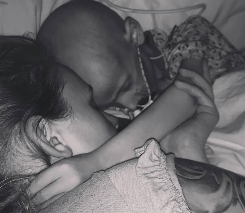 Charlie Proctor, 5, who was diagnosed with liver cancer in 2016 has died. He’s pictured cuddling his mum Amber Schofield hours before his death. Source: Facebook/ Charlie’s Chapter.