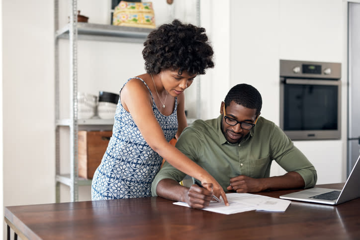 A couple calculates their net worth