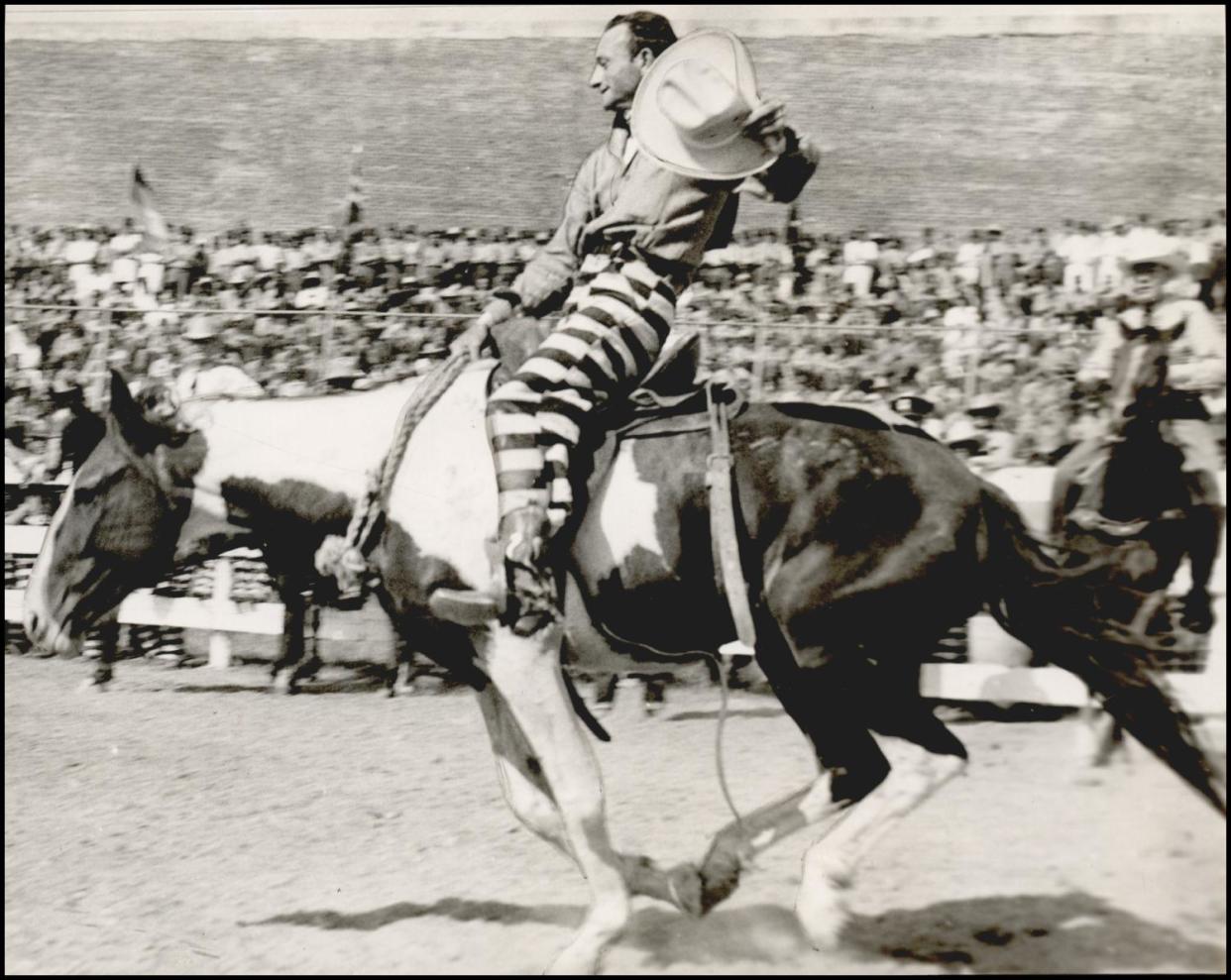 An inmate rides atop a bronc on Sept. 20, 1941, during the prison rodeo at the Oklahoma State Penitentiary in McAlester.