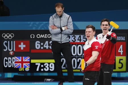 Curling - Pyeongchang 2018 Winter Olympics - Men’s Tie-Breaker - Switzerland v Britain - Gangneung Curling Center - Gangneung, South Korea - February 22, 2018 - Claudio Patz and Peter de Cruz of Switzerland react next to Thomas Muirhead of Britain. REUTERS/Cathal McNaughton