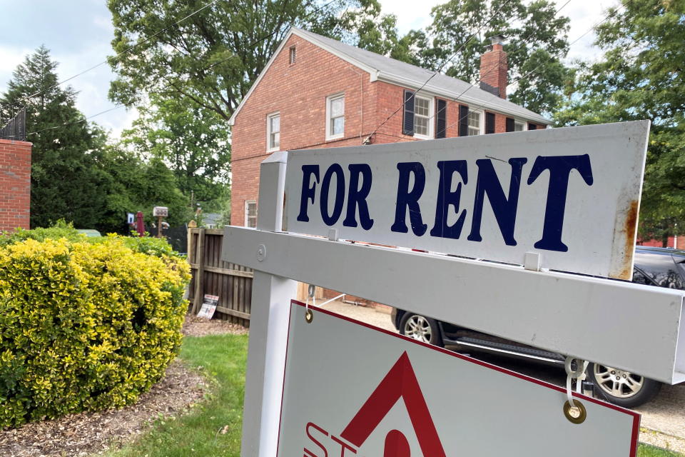 A for-rent sign is placed in front of a home in Arlington, Va., on June 8, 2021. 