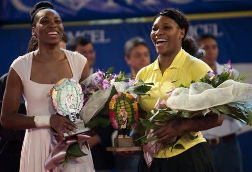 US tennis players Serena (R) and Venus Williams laugh after a 2011 exhibition match. After over a decade as the sport's most dominant forces, both Serena and Venus head into Wimbledon, which starts on Monday, without a grand slam title between them since 2010