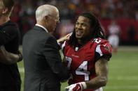 Jan 22, 2017; Atlanta, GA, USA; Atlanta Falcons running back Devonta Freeman (24) celebrates with team president Rich McKay on the sidelines during the fourth quarter against the Green Bay Packers in the 2017 NFC Championship Game at the Georgia Dome. Atlanta defeated Green Bay 44-21. Mandatory Credit: Jason Getz-USA TODAY Sports