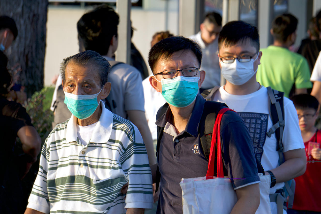 People wearing masks seen outside the Woodlands Checkpoint on 17 March 2020. (PHOTO: Dhany Osman / Yahoo News Singapore)