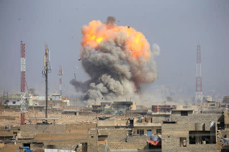 Smoke rises after an airstrike, during the battle against Islamic State militants, at the district of al-Mamoun in Mosul, Iraq, March 1, 2017. REUTERS/Alaa Al-Marjani