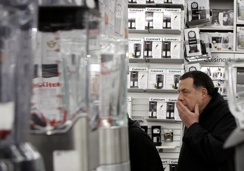 A man takes a closer look at kitchen appliances while shopping inside of a Bed Bath & Beyond store in New York April 13, 2011. REUTERS/Lucas Jackson