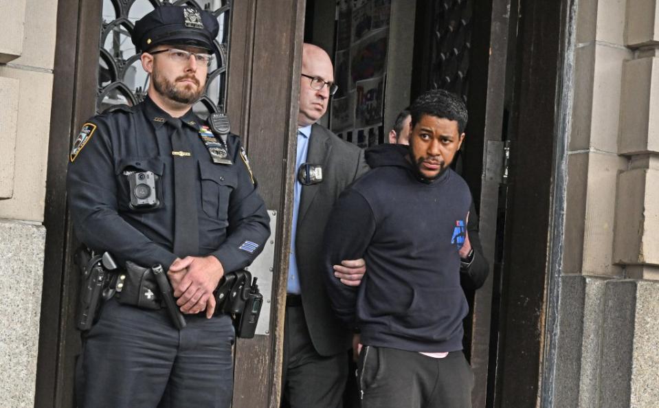 Jones, 41, ignored shouted questions from reporters and avoided eye contact as he was led out of the NYPD’s 101st Precinct in Far Rockaway at around 12:30 p.m. Gregory P. Mango