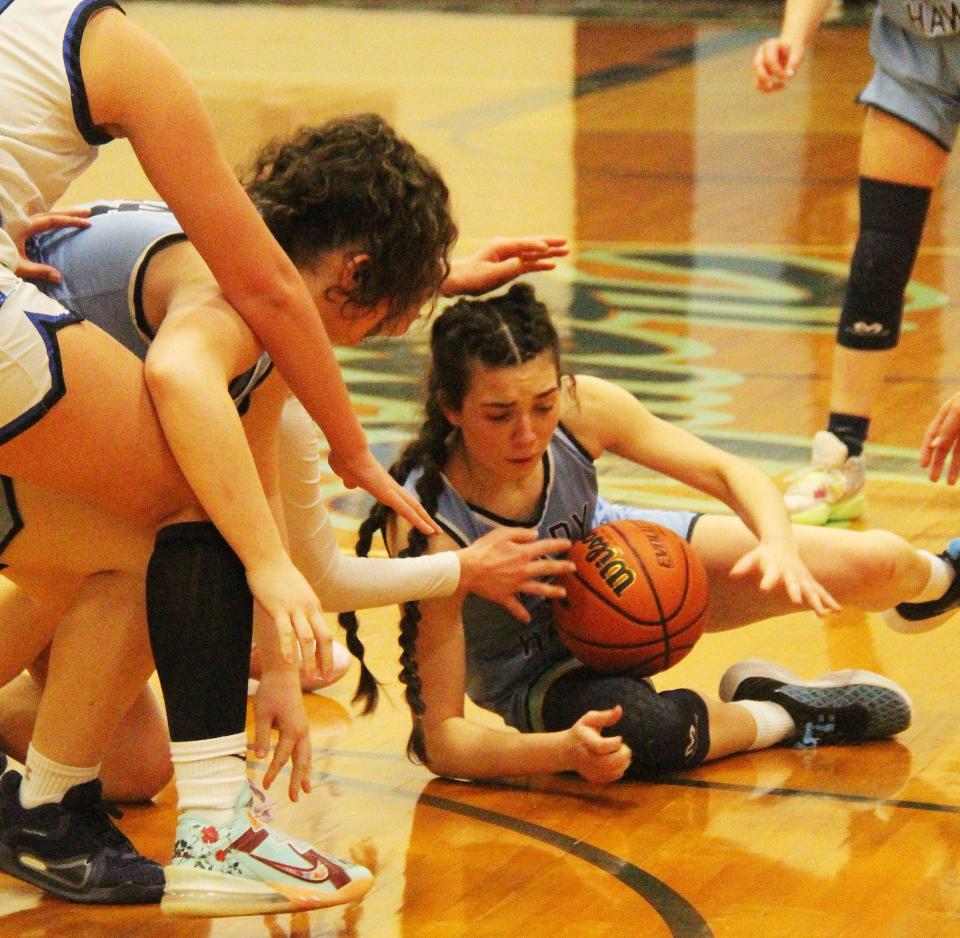 Prairie Central's Chloe Sisco tries to corral the ball in a scramble on the floor Friday, Feb. 17. Prairie Central lost 70-57 to Peotone in the Class 2A regional final in Fairbury.