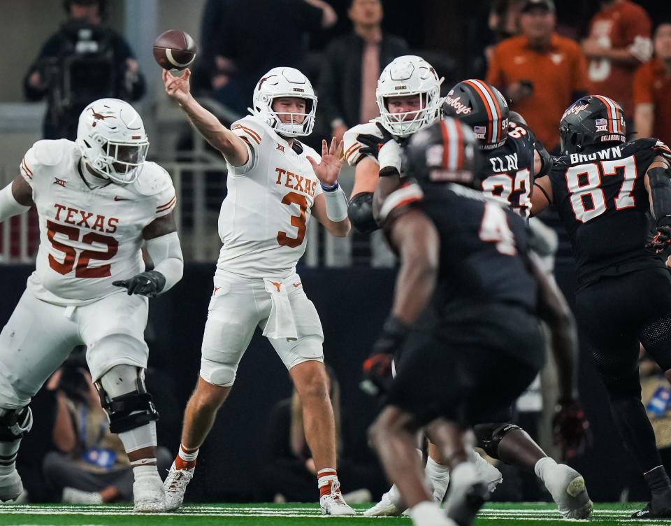 Texas quarterback Quinn Ewers sends a pass to a teammate in the third quarter of the Big 12 title game at AT&T Stadium in Arlington on Saturday. Texas won the game 49-21 to become the 2023 Big 12 champions.