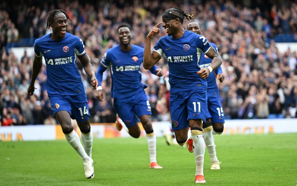 Noni Madueke of Chelsea celebrates scoring his team's third goal with teammate Trevoh Chalobah during the Premier League match