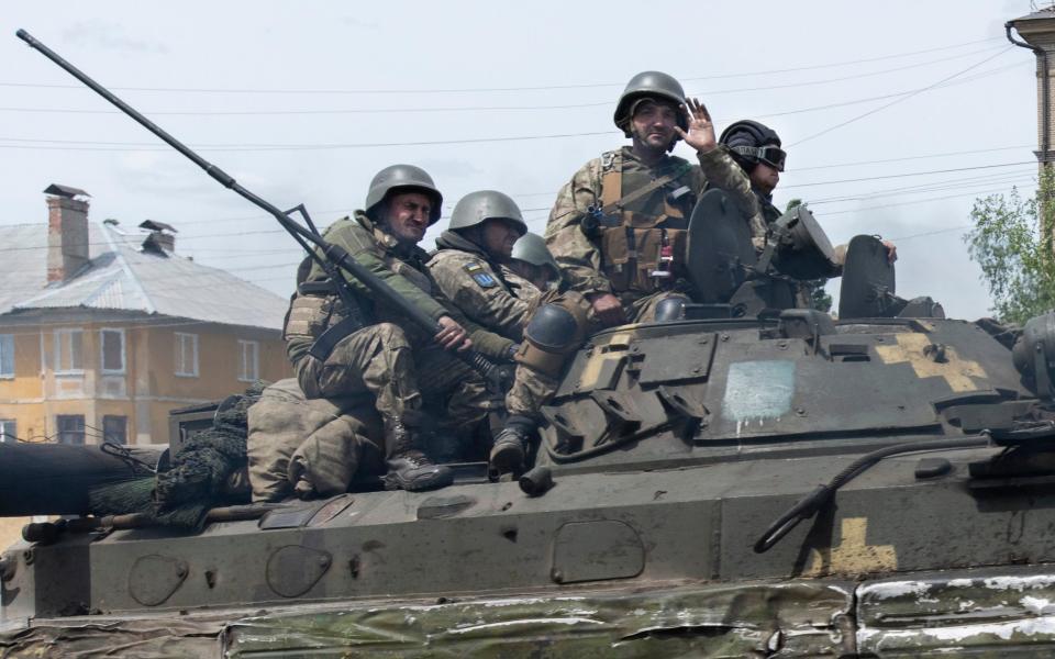 Mcc0104874 Ukrainian Soldiers on armoured transport move foreward near the town of Bakhmut, heading towards the russian front and the now contentested road to Sievierodonetsk in the Donetsk Oblast. Photograph by David Rose, For the Telegraph. 27th May 2022 Donetsk Oblast  - Telegraph/ David Rose 