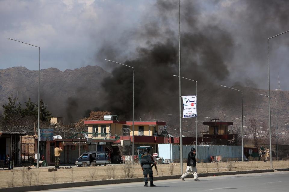 Smoke rises from a district police headquarters after a suicide bombing in Kabul, Afghanistan, Wednesday, March 1, 2017. An Afghan official says that a suicide car bomber attacked at the gates of a police station in the western part of the capital, Kabul. (AP Photo/ Rahmat Gul)