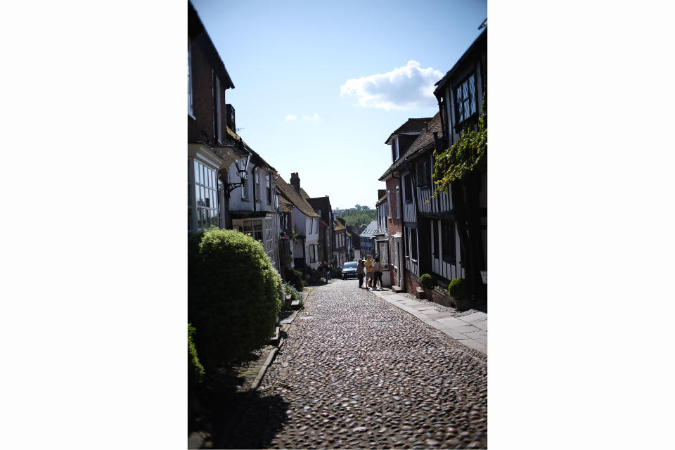 A pretty street scene showing cobbled road and shops, shot on the TTArtisan 25mm F/2 lens