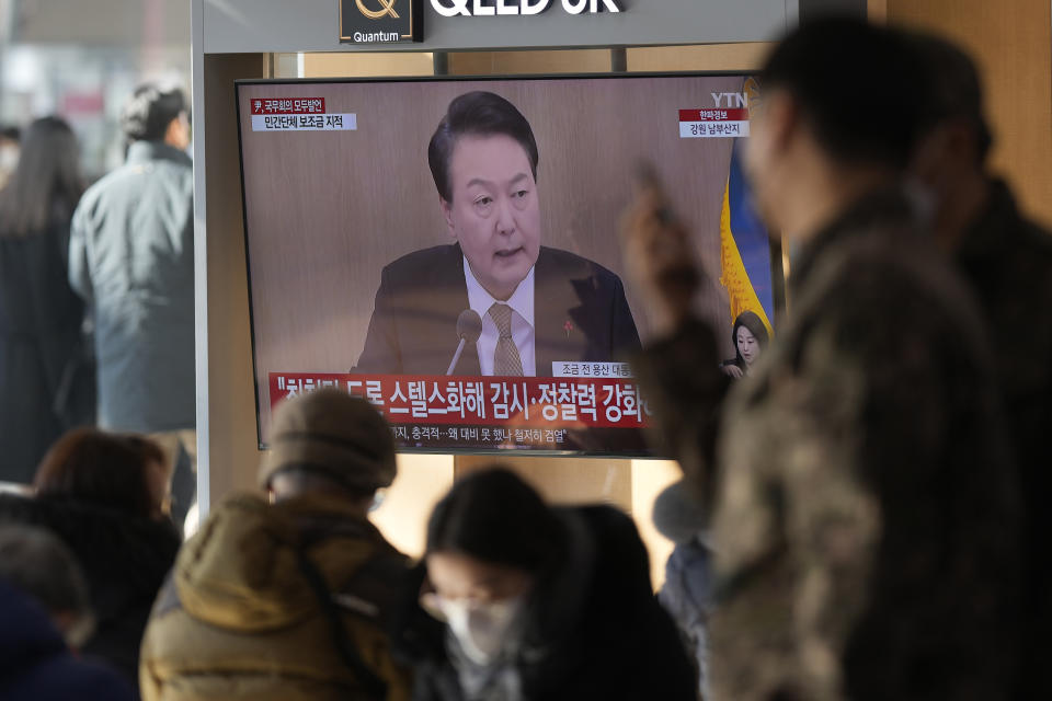 A TV screen shows a news program reporting about South Korean President Yoon Suk Yeol speaking during a cabinet council meeting, at the Seoul Railway Station in Seoul, South Korea, Tuesday, Dec. 27, 2022. President Yoon on Tuesday called for a stronger air defense and high-tech stealth drones to better monitor North Korea, a day after it accused five North Korea of flying drones across the rivals’ tense border for the first time in five years. (AP Photo/Lee Jin-man)