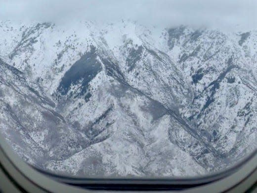 A view of Utah's peaks from outside plane window