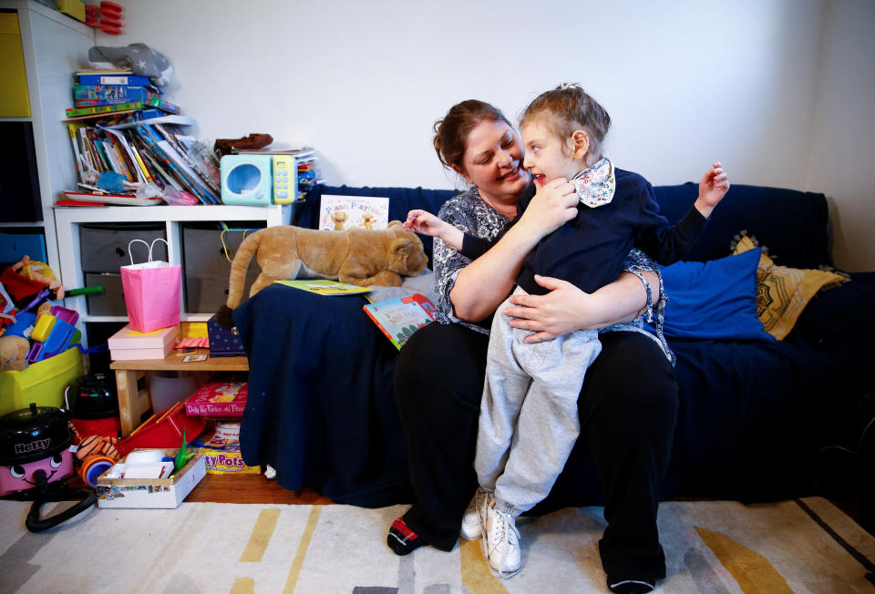 Jo Elgarf holds her daughter Nora at their home in London, Britain, January 30, 2019. Picture taken January 30, 2019. REUTERS/Henry Nicholls