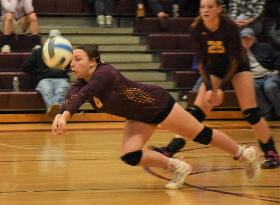 A Canastota players dives to dig up a Dolgeville serve during the second game of the teams' Tuesday, Jan. 23, 2024, match in Canastota, New York.