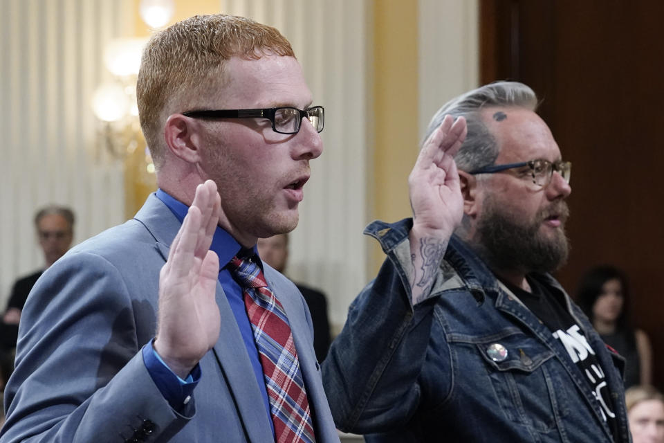 Stephen Ayres, who pleaded guilty in June 2022 to disorderly and disruptive conduct in a restricted building, left, and Jason Van Tatenhove, an ally of Oath Keepers leader Stewart Rhodes, right, are sworn in to testify as the House select committee investigating the Jan. 6 attack on the U.S. Capitol holds a hearing at the Capitol in Washington, Tuesday, July 12, 2022. The Jan. 6 congressional hearings have paused, at least for now, and Washington is taking stock of what was learned about the actions of Donald Trump and associates surrounding the Capitol attack. (AP Photo/J. Scott Applewhite)