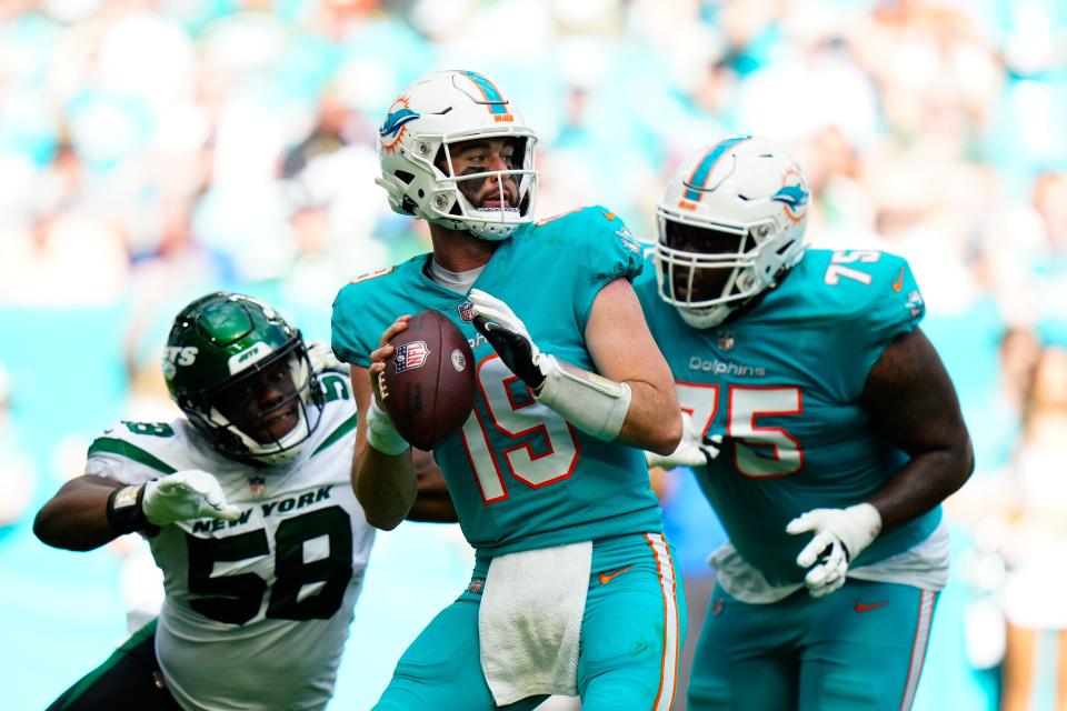 Backup QB Skylar Thompson (19) managed to lead the Dolphins to the AFC's final wild-card berth Sunday.
