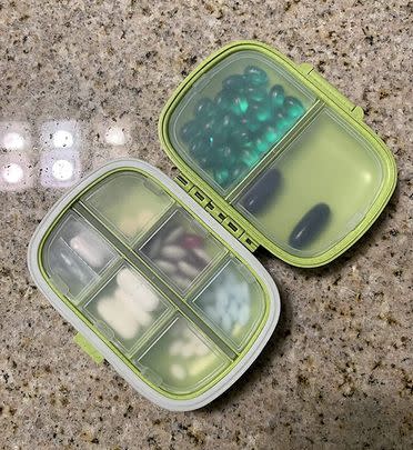 An eight-compartment pill organizer