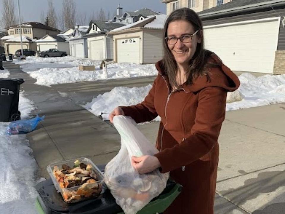 City of Edmonton education program supervisor Erika Droessler offers tips for managing waste carts in the winter. (Samuel Martin/CBC - image credit)